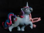 Blue unicorn with dark pink spots