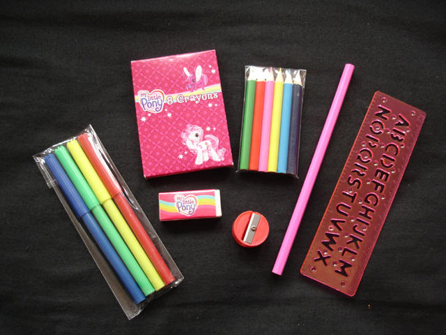 Came with MLP eraser & crayons and generic pencil, stencil ruler, coloured pencils and felt pens