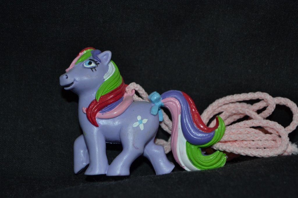 Purple earth pony with flower