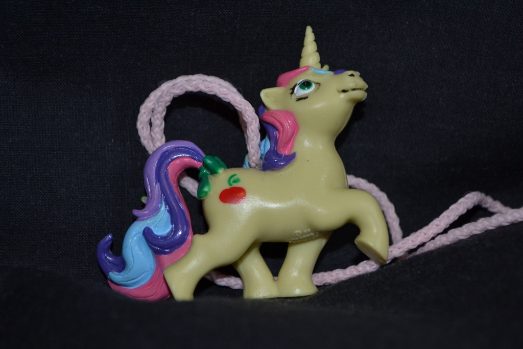 Yellow unicorn with apple