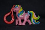 Dark pink earth pony with flower